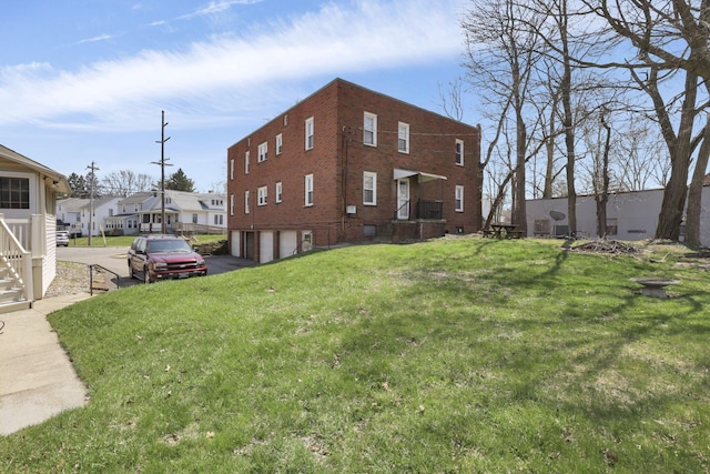 exterior space with driveway and a garage