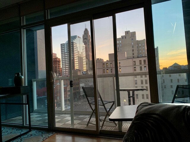 100 E Gay St Unit 607, Columbus, OH 43215 - entryway with a view of skyline, plenty of natural light, and wood finished floors