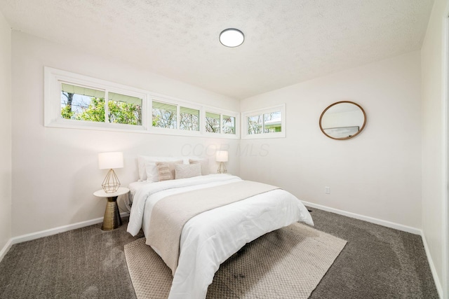 carpeted bedroom with baseboards