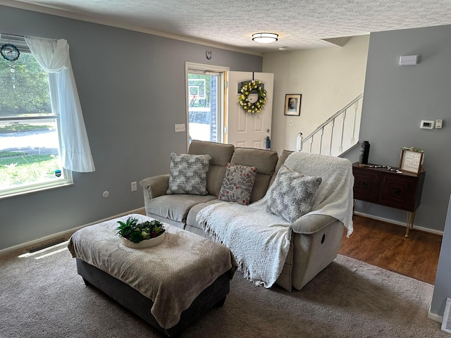 604 Forestwood Dr, Gahanna, OH 43230 - living room featuring stairway, plenty of natural light, carpet, and a textured ceiling