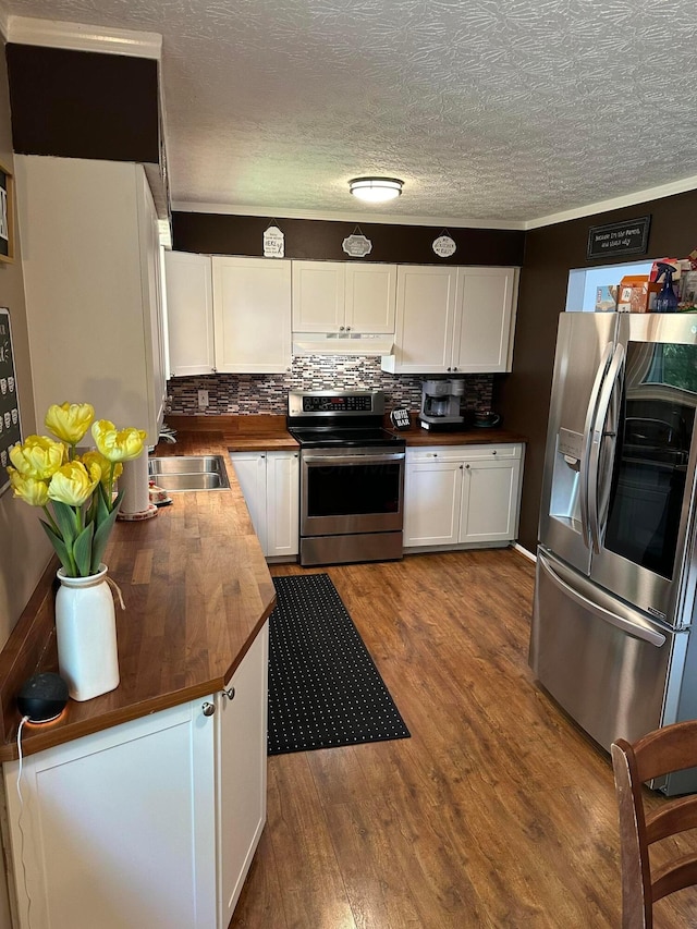 604 Forestwood Dr, Gahanna, OH 43230 - kitchen with appliances with stainless steel finishes, butcher block countertops, white cabinetry, under cabinet range hood, and a textured ceiling