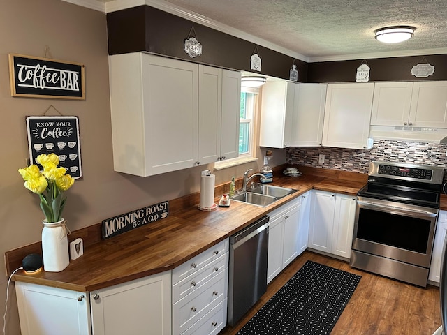 604 Forestwood Dr, Gahanna, OH 43230 - kitchen with butcher block countertops, stainless steel appliances, under cabinet range hood, wood finished floors, and crown molding