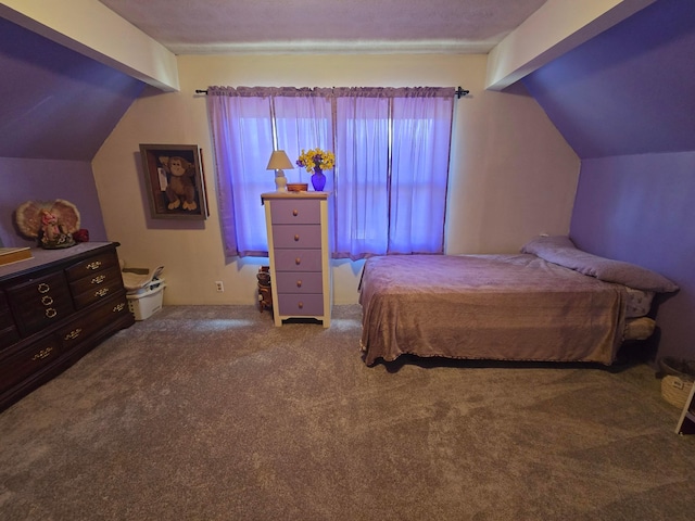 carpeted bedroom featuring vaulted ceiling