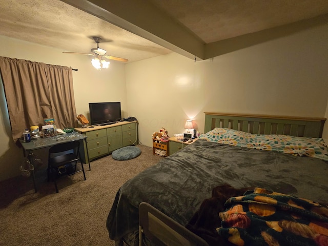 carpeted bedroom with ceiling fan and beamed ceiling