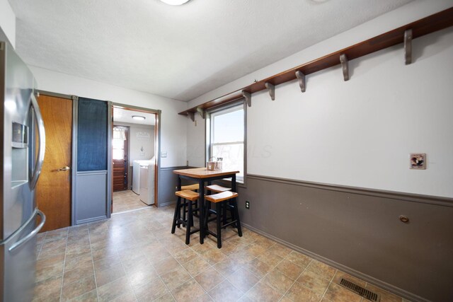 49 Front St, Orient, OH 43146 - dining room featuring baseboards, visible vents, washing machine and dryer, and a healthy amount of sunlight