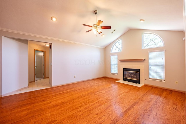 unfurnished living room featuring lofted ceiling, wood finished floors, visible vents, and ceiling fan