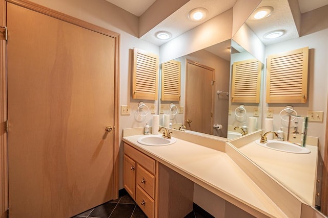 bathroom featuring vanity, tile patterned flooring, and radiator