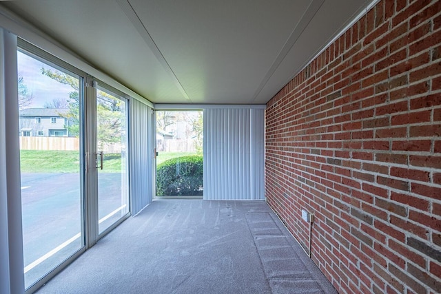 unfurnished sunroom with a wealth of natural light