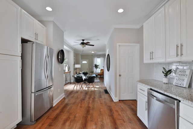 kitchen with stainless steel appliances and white cabinets