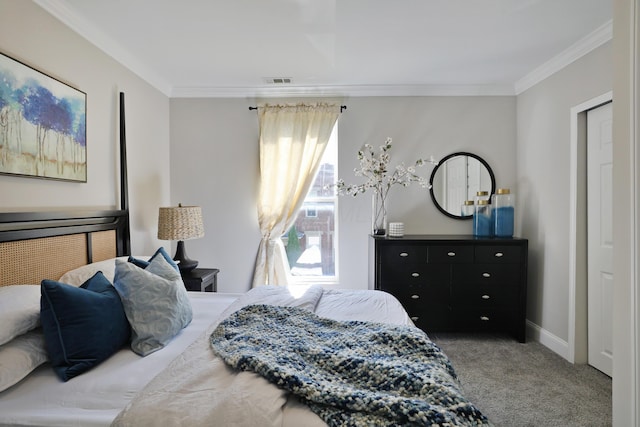 bedroom featuring ornamental molding, carpet floors, baseboards, and visible vents