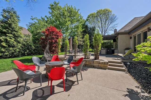 3906 Tarrington Ln, Columbus, OH 43220 - view of patio featuring a fire pit