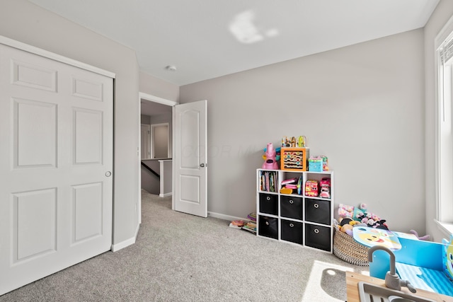 game room featuring carpet and baseboards
