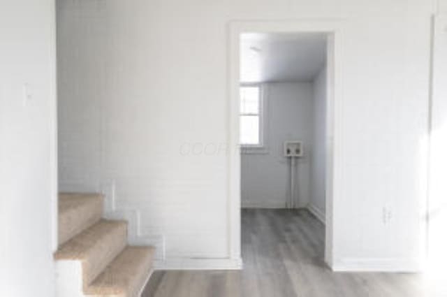 404 Sherman Ave, Springfield, OH 45503 - staircase with baseboards and wood finished floors