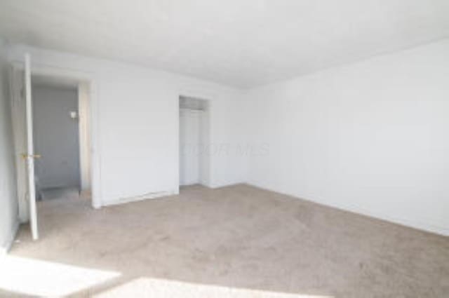 404 Sherman Ave, Springfield, OH 45503 - unfurnished bedroom with carpet floors and a closet