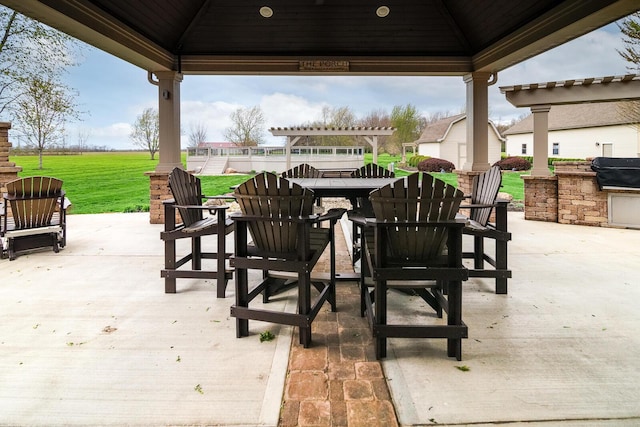 view of patio / terrace featuring a gazebo, area for grilling, and outdoor dining area
