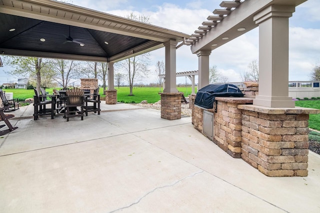 view of patio featuring exterior kitchen, a ceiling fan, outdoor dining area, and a grill