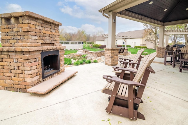 view of patio / terrace featuring an outdoor fireplace