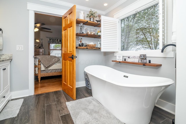 ensuite bathroom with a healthy amount of sunlight, baseboards, and connected bathroom