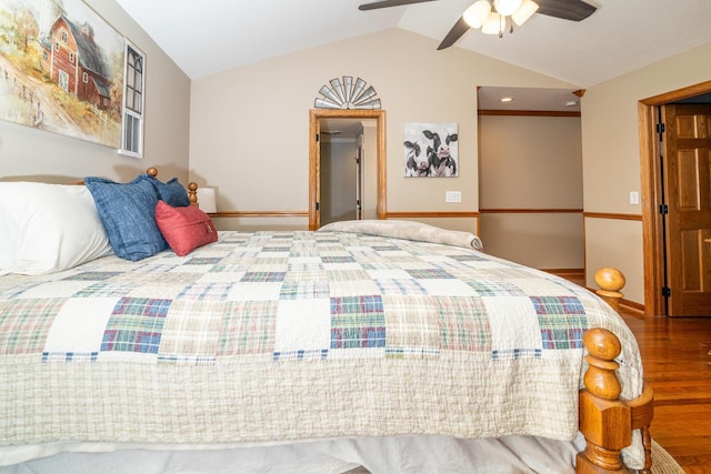 bedroom featuring vaulted ceiling, wood finished floors, baseboards, and ceiling fan