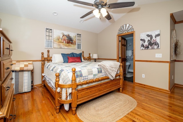 bedroom featuring lofted ceiling, baseboards, wood finished floors, and ceiling fan