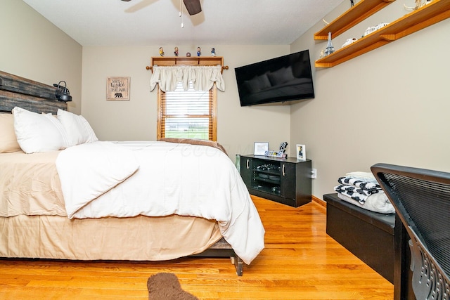 bedroom with wood finished floors and ceiling fan