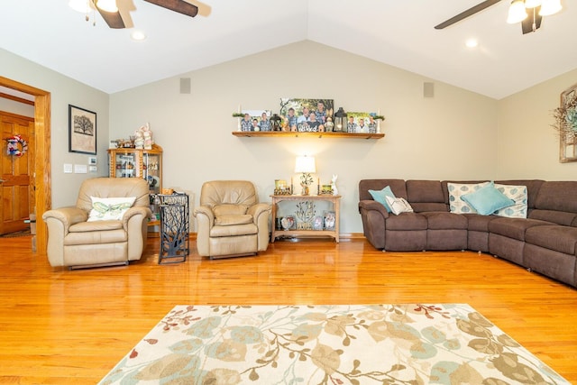 living room with lofted ceiling, a ceiling fan, and wood finished floors