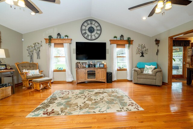 living area featuring recessed lighting, light wood-style floors, lofted ceiling, and a ceiling fan