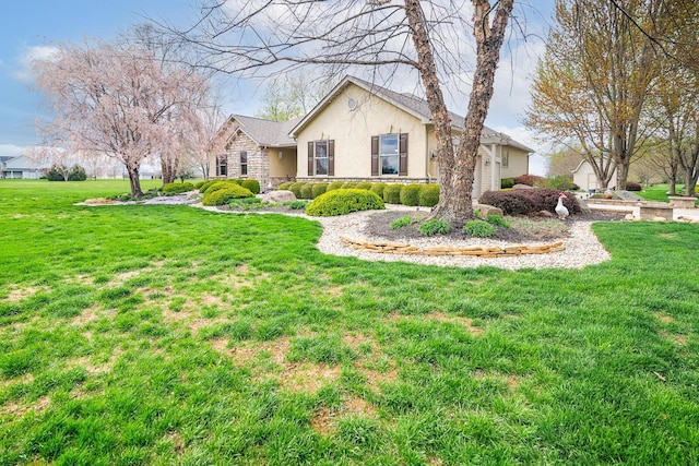 view of front facade featuring stone siding, a front lawn, and stucco siding