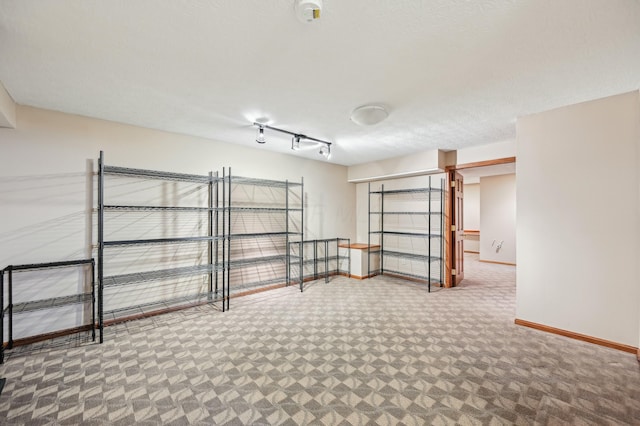 interior space with carpet floors and baseboards
