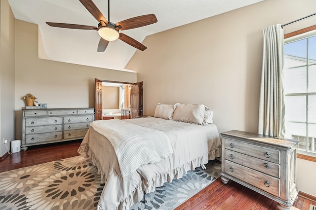 bedroom featuring ceiling fan, lofted ceiling, and wood finished floors