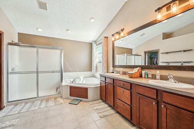 full bath featuring a sink, vaulted ceiling, visible vents, a shower stall, and a garden tub