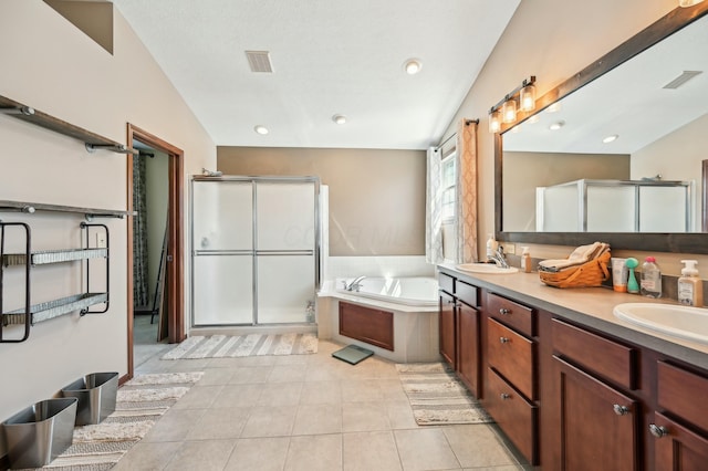 bathroom with a shower stall, a garden tub, a sink, double vanity, and visible vents