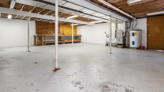 unfinished basement featuring water heater