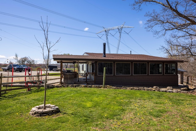 9704 Loudon St, Johnstown, OH 43031 - back of house with roof with shingles, fence, and a yard