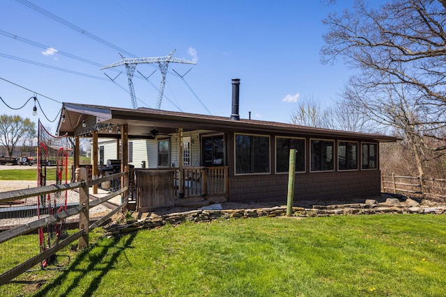9704 Loudon St, Johnstown, OH 43031 - back of property with a lawn, a porch, and fence