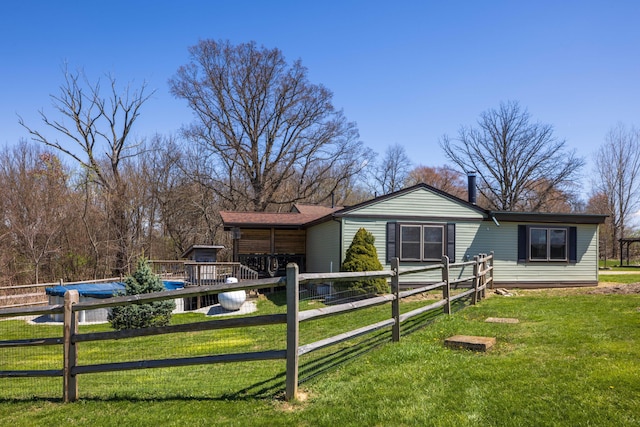 9704 Loudon St, Johnstown, OH 43031 - view of front facade with a garage, a front yard, and fence