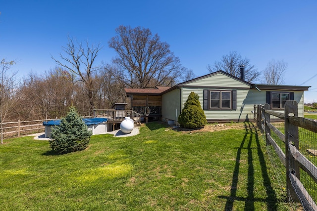 9704 Loudon St, Johnstown, OH 43031 - back of property with a lawn, fence, and a deck