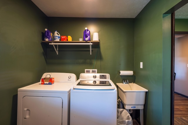 9704 Loudon St, Johnstown, OH 43031 - clothes washing area with separate washer and dryer, wood finished floors, a sink, and laundry area