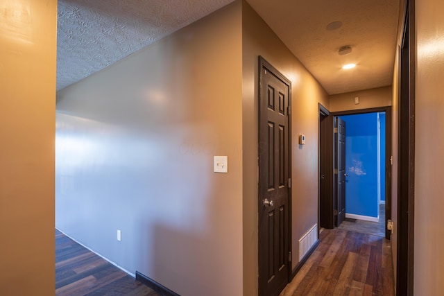 9704 Loudon St, Johnstown, OH 43031 - hall with a textured ceiling, baseboards, and dark wood-style flooring