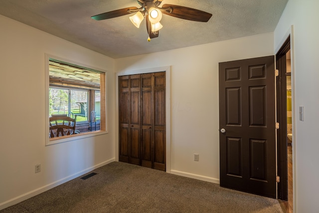 9704 Loudon St, Johnstown, OH 43031 - unfurnished bedroom featuring a textured ceiling, a closet, carpet floors, baseboards, and visible vents