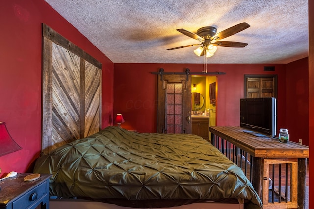 9704 Loudon St, Johnstown, OH 43031 - bedroom with a barn door, a textured ceiling, and visible vents