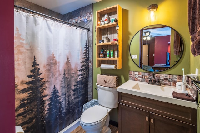 9704 Loudon St, Johnstown, OH 43031 - full bath with a shower with curtain, a ceiling fan, vanity, and toilet