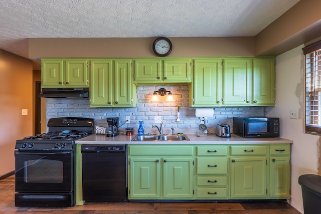 9704 Loudon St, Johnstown, OH 43031 - kitchen with a sink, a textured ceiling, black appliances, green cabinets, and under cabinet range hood