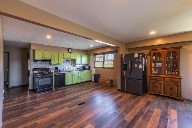 9704 Loudon St, Johnstown, OH 43031 - kitchen featuring under cabinet range hood, black appliances, dark wood-style flooring, and green cabinetry
