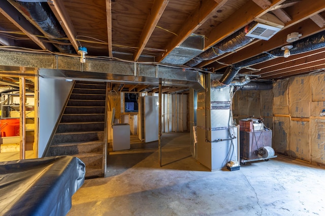 9704 Loudon St, Johnstown, OH 43031 - unfinished basement featuring heating unit, stairs, and visible vents