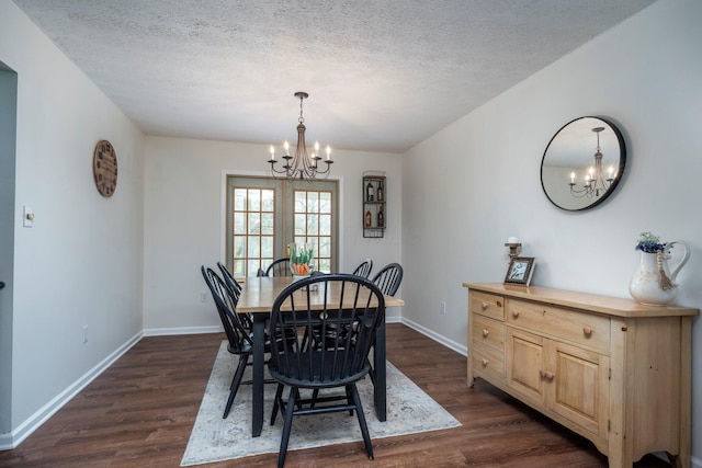 1005 Glenn Ave, Washington Court House, OH 43160 - dining space featuring a chandelier, dark wood finished floors, baseboards, and a textured ceiling