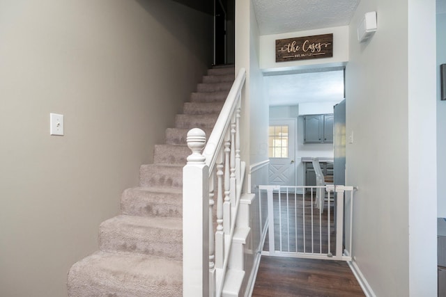 1005 Glenn Ave, Washington Court House, OH 43160 - staircase featuring baseboards and wood finished floors