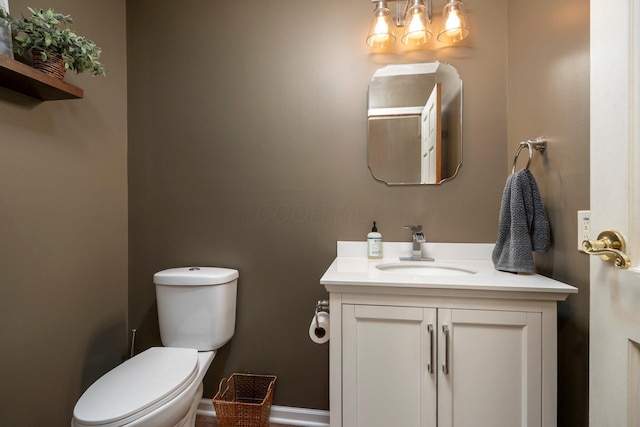 1005 Glenn Ave, Washington Court House, OH 43160 - half bathroom with vanity, toilet, and baseboards