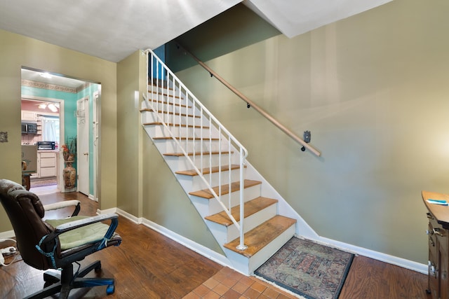 1479 Devonhurst Dr, Columbus, OH 43232 - stairway with baseboards and wood finished floors