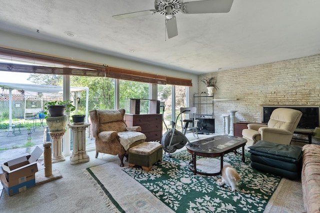 1479 Devonhurst Dr, Columbus, OH 43232 - carpeted living room with a ceiling fan and a brick fireplace
